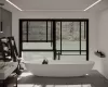 Bathroom featuring tile patterned flooring, a washtub, and a wealth of natural light