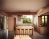 Kitchen with a wealth of natural light, a breakfast bar, sink, decorative light fixtures, and a kitchen island