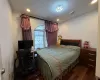 Bedroom featuring dark wood-type flooring