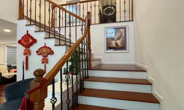 Staircase featuring ornamental molding