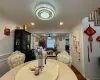 Dining area featuring crown molding and dark wood-type flooring