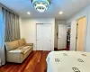 Bedroom with a chandelier, a closet, and dark wood-type flooring