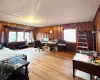 Office featuring light hardwood / wood-style flooring and wood walls