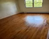 Spare room featuring hardwood / wood-style flooring and a baseboard heating unit