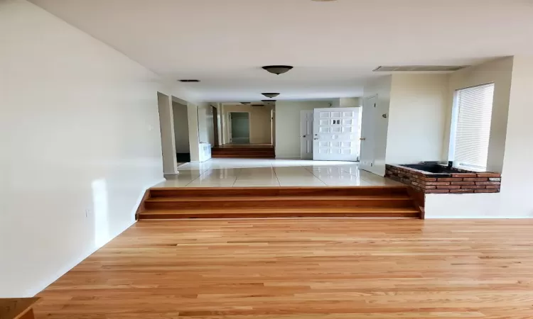 Hall featuring light wood-type flooring