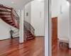 Stairs featuring hardwood / wood-style flooring