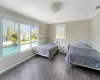 Bedroom with dark wood-type flooring