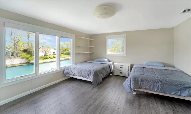 Bedroom with dark wood-type flooring