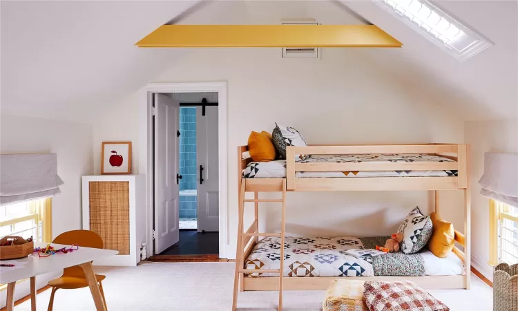 Bedroom with vaulted ceiling with beams