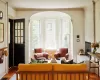 Living area featuring a fireplace, hardwood / wood-style flooring, and ornamental molding