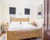 First floor bedroom with windows, and ornamental molding