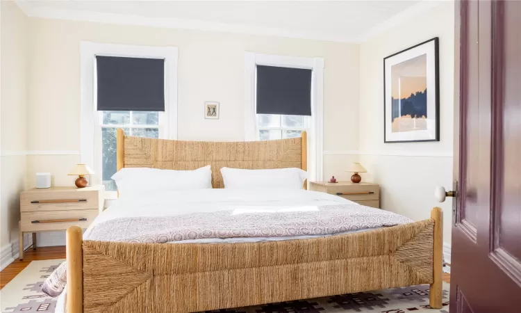 First floor bedroom with windows, and ornamental molding