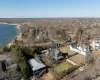 Birds eye view of property with a water view