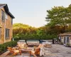 View of patio featuring an outdoor living space with a fire pit