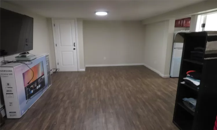 Kitchen featuring dark wood-type flooring