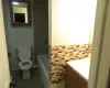 Full bathroom with tile patterned flooring, shower / bathing tub combination, vanity, and toilet