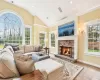 Living room with a chandelier, a healthy amount of sunlight, and vaulted ceiling