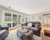 Living room featuring high vaulted ceiling and a notable chandelier