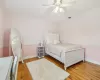 Bedroom featuring ceiling fan, a closet, and ornamental molding