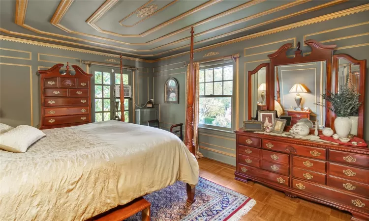 Bedroom with parquet flooring