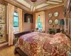 Bedroom featuring light parquet flooring, cooling unit, and crown molding