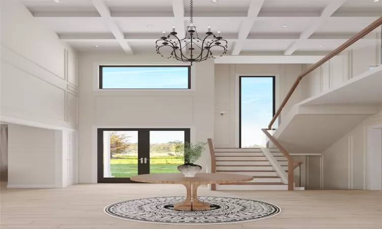 Rendering - Foyer entrance with a high ceiling, coffered ceiling, an inviting chandelier, french doors, and beam ceiling