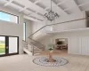 Rendering - Entryway with light wood-type flooring, french doors, and a towering ceiling