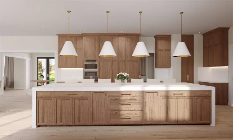 Rendering - Kitchen with a large island, stainless steel double oven, decorative light fixtures, and light hardwood / wood-style floors