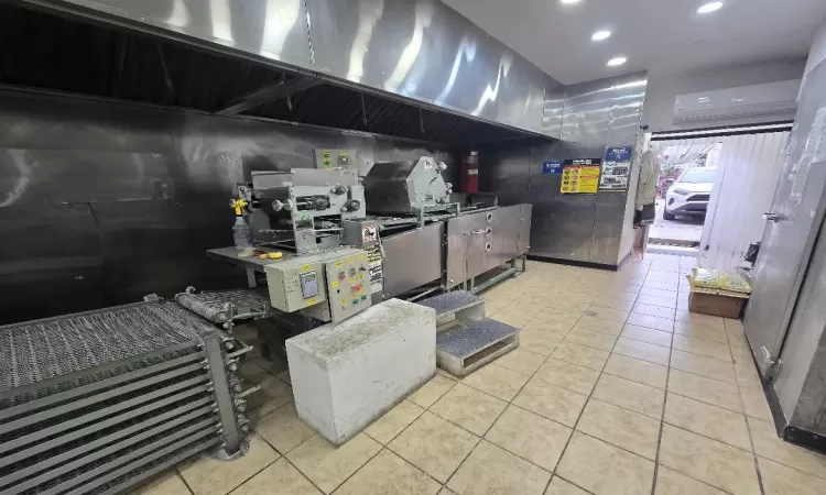 Kitchen with light tile patterned floors