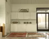 Washroom with wooden walls and sink