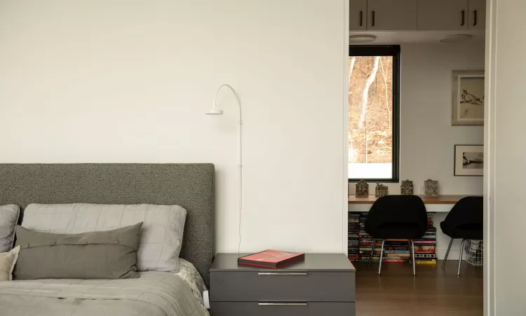 Bedroom featuring dark wood-type flooring