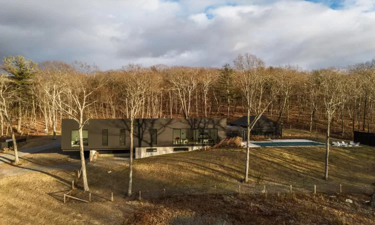 View of yard featuring a patio area and a covered pool