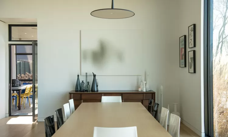 Dining space with hardwood / wood-style floors