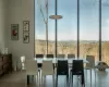 Dining room with hardwood / wood-style floors and a mountain view