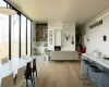 Living room with light hardwood / wood-style floors and floor to ceiling windows