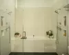 Bathroom featuring tile patterned floors and plus walk in shower