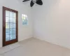 Spare room with ceiling fan, light colored carpet, and ornamental molding