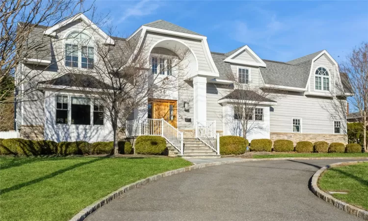 View of front of property with a front lawn