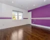 Unfurnished room featuring dark wood-type flooring