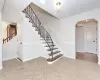 Stairs featuring tile patterned floors