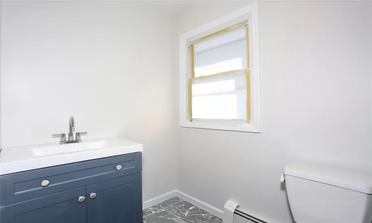 Bathroom with vanity and toilet