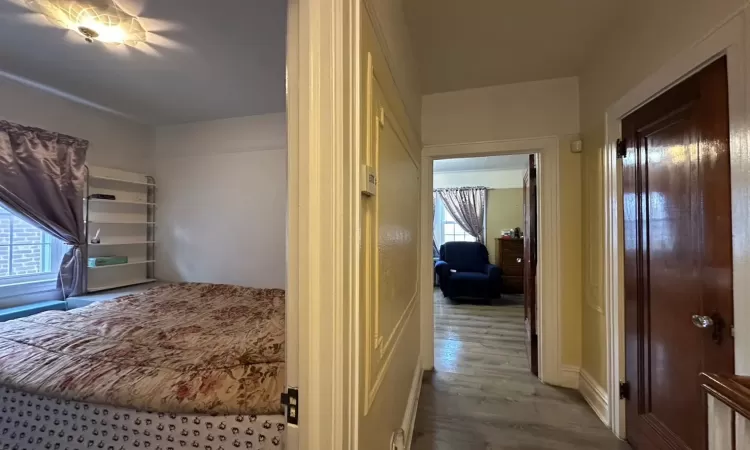 Hallway with light hardwood / wood-style floors