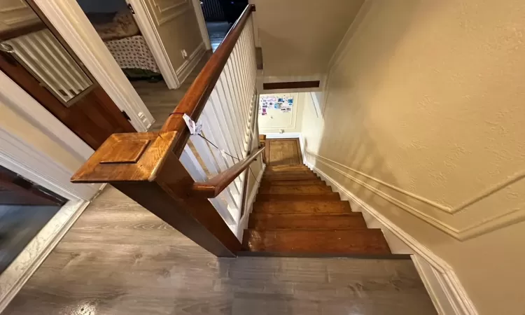 Staircase with wood-type flooring