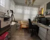 Office area with light hardwood / wood-style floors and an inviting chandelier