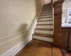 Staircase with hardwood / wood-style flooring