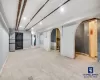 Basement featuring stainless steel refrigerator