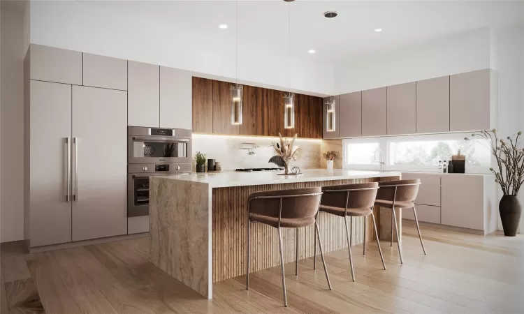 Kitchen featuring a kitchen bar, light stone countertops, double oven, a center island, and built in fridge