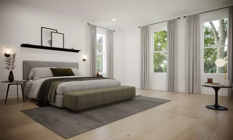 Bedroom featuring light hardwood / wood-style floors and multiple windows