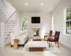 Living room featuring light hardwood / wood-style floors and plenty of natural light