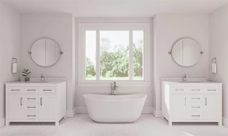 Bathroom with a wealth of natural light, a washtub, and vanity